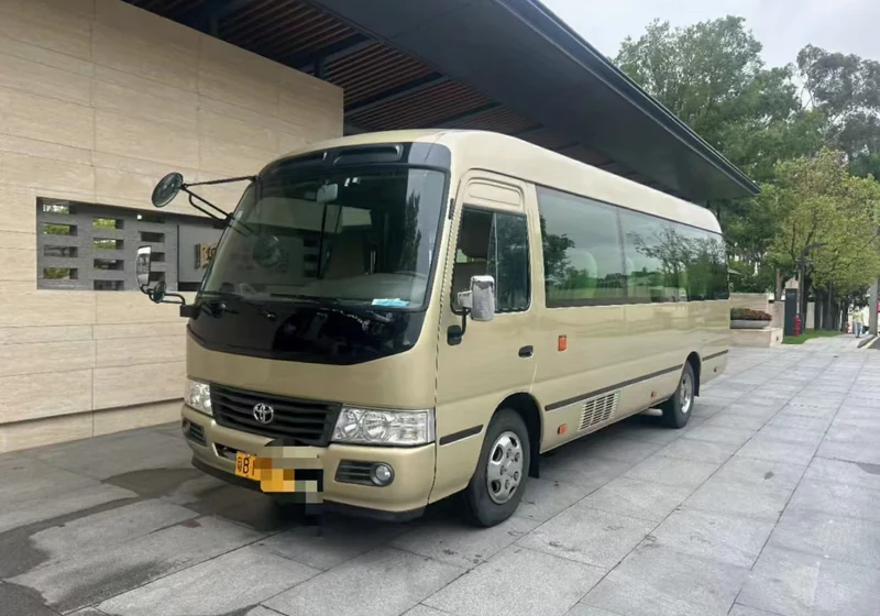 14-seat business minibus waiting at the station forecourt for a group pick-up